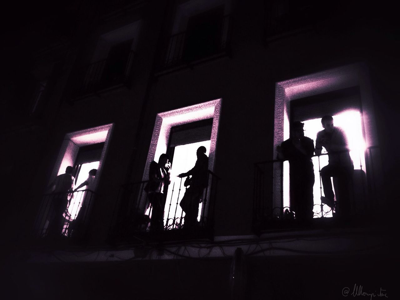 illuminated, lifestyles, men, night, silhouette, leisure activity, architecture, built structure, full length, indoors, standing, person, dark, rear view, building exterior, window, togetherness