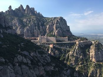 Panoramic view of montserrat rocks and mountains against sky