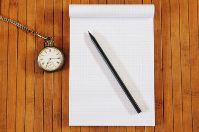 High angle view of clock on table