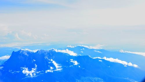 Low angle view of mountain range against sky