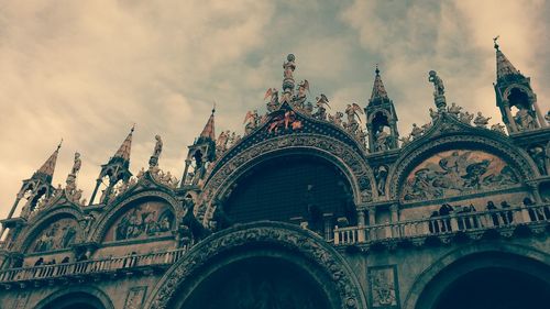 Low angle view of cathedral against cloudy sky