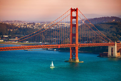 View of suspension bridge in water