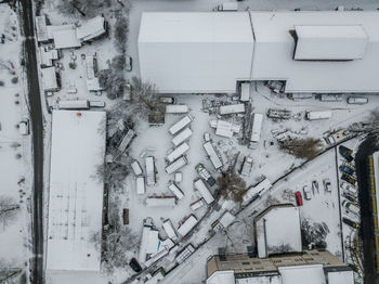 High angle view of snow covered wall by building
