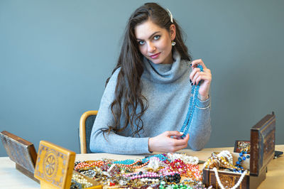 Portrait of young woman looking at camera