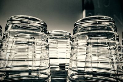 Close-up of upside down glasses on table