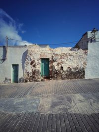 Exterior of old building against blue sky