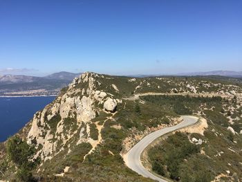 Scenic view of mountains against clear blue sky