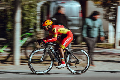 Man riding bicycle on street