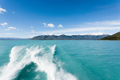 Scenic view of sea against blue sky