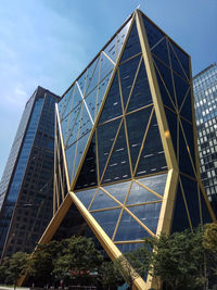 Low angle view of modern buildings against sky