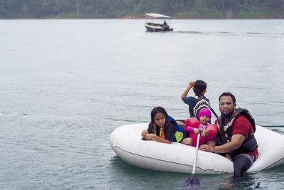 High angle view of people sitting on boat