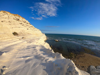 Scenic view of sea against blue sky