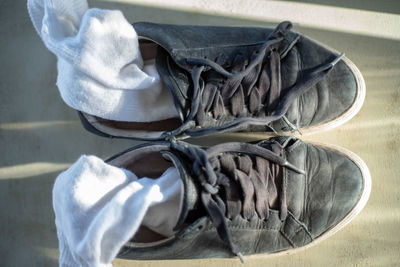 Close-up directly above shot of socks in shoes on table