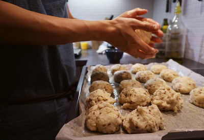 Midsection of man preparing food on table