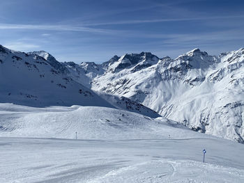 Scenic view of snowcapped mountains against sky