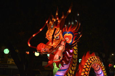 Illuminated dragon at night