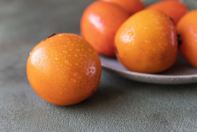 Close-up of oranges on table