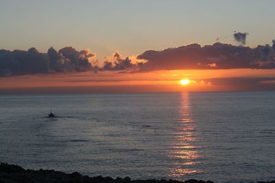 Scenic view of sea against sky at sunset