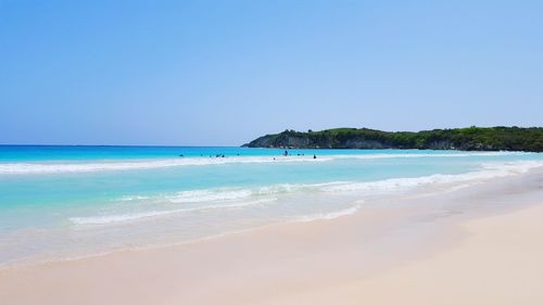 Scenic view of beach against clear sky