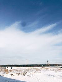 Scenic view of beach against blue sky
