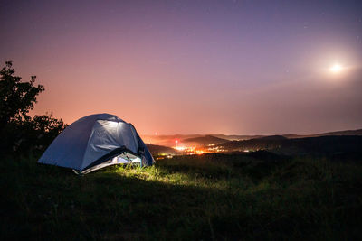 Tent against sky during sunset