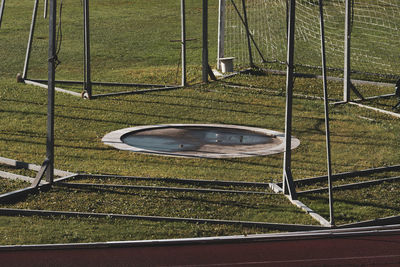 High angle view of field seen through fence