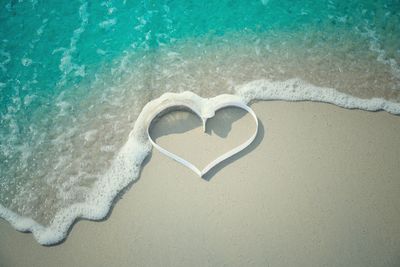 High angle view of heart shape on beach