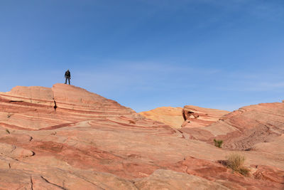 Scenic view of desert against clear blue sky