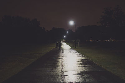 Man on road at night