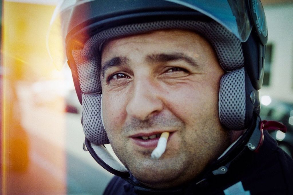 headshot, portrait, looking at camera, person, young adult, lifestyles, young men, close-up, front view, head and shoulders, leisure activity, human face, focus on foreground, indoors, smiling, mid adult, mid adult men, stubble
