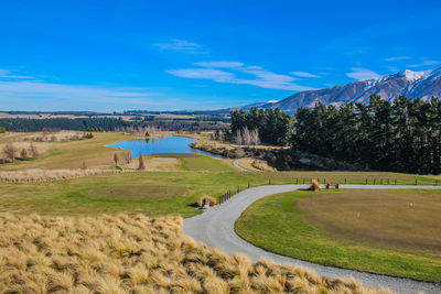 Scenic view of landscape against blue sky