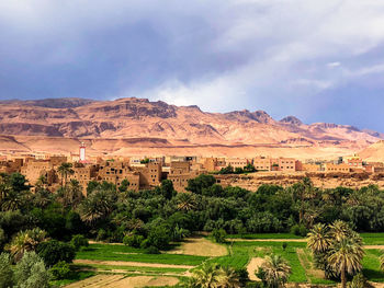 Scenic view of landscape and mountains against sky