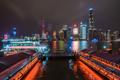 Illuminated buildings in city at night