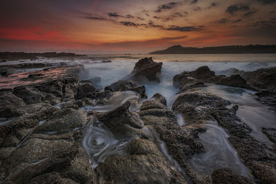 Scenic view of sea against sky during sunset