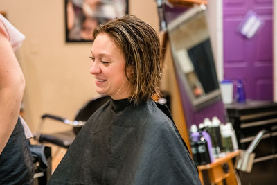 Young woman standing at home