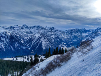 Snow covered mountains against sky