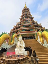 Low angle view of statue against building