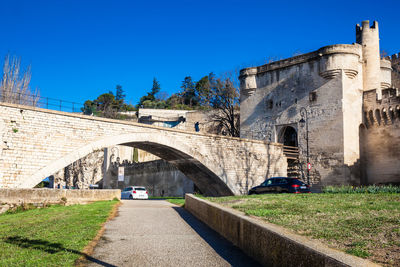 Arch bridge against clear blue sky