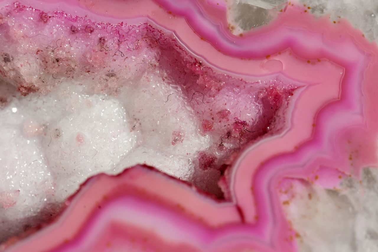 FULL FRAME SHOT OF PINK WATER IN GLASS