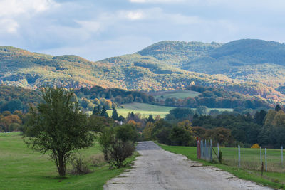 Scenic view of landscape and mountains against sky