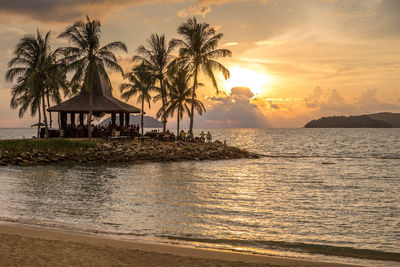 Scenic view of sea against sky at sunset