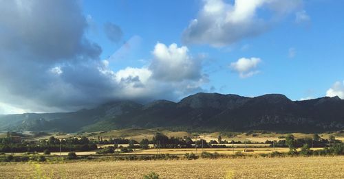 Landscape with mountain range in background