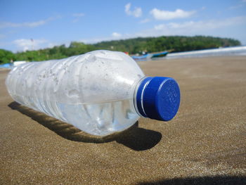 Water bottle against sky