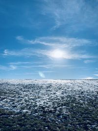 Scenic view of sea against blue sky