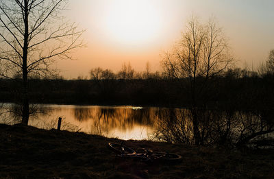 Scenic view of lake against sky during sunset