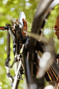 Cropped image of man riding bicycle