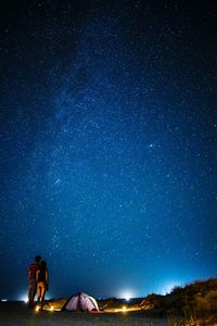 Low angle view of tent against star field at night