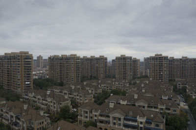 High angle view of buildings in city against sky