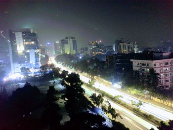 High angle view of illuminated street and buildings at night