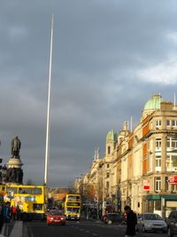 View of buildings against cloudy sky